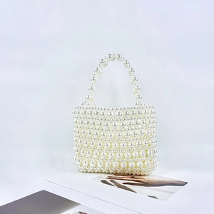 Elegant hand-woven pearl tote bag with a vintage square shape and beaded top handle