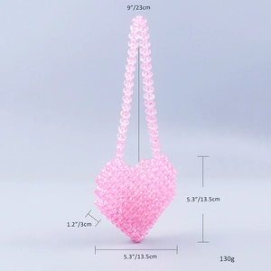 Pink heart-shaped beaded mini bag with detailed dimensions and handle measurements