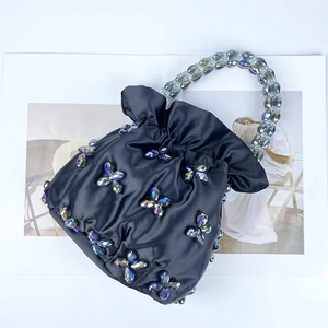 Handcrafted black satin bucket bag with colorful crystal floral beadwork and beaded handle