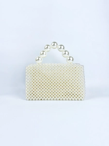 Detail of handmade pearl bead handbag with large pearl handle and square woven pattern