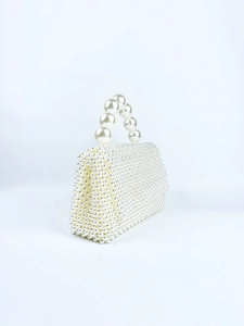 Detailed view of handmade square white pearl beaded handbag with large bead handle
