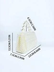 Detail view of handmade pearl handbag with dimensions 22x7.5x13.5 cm and large bead handle