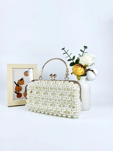 Elegant white faux pearl woven evening handbag with golden metal frame and kiss-lock closure