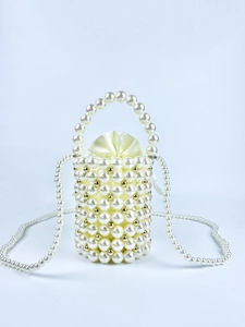 Detail of beaded pearl bucket bag with gold metal beads and cream satin drawstring