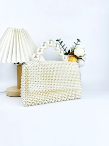 Handcrafted pearl beaded handbag with large top handle and elegant rectangular flap design