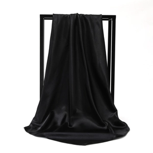 Elegant 90cm black satin square scarf with a glossy finish hanging on a metal frame
