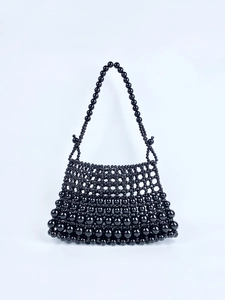 Sac à main artisanal en perles noires avec design tissé et bandoulière vintage