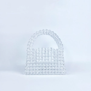 Detail of handcrafted clear beaded handbag showing intricate faceted crystal beadwork