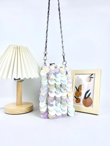 Chic shimmering sequin crossbody mini bag with silver chain strap and pearlescent finish