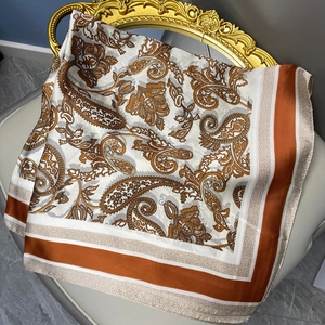 Elegant satin silk square scarf with vintage brown paisley print on white background
