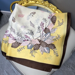 70cm satin square scarf with lemon yellow shell print and elegant silk texture on chair