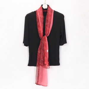 Detail of red leopard print georgette scarf paired with black ribbed short sleeve top