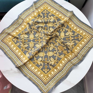Baroque pattern satin square scarf with Greek key border on white marble background
