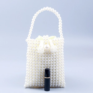 Elegant white faux pearl beaded handbag with satin drawstring lining and single handle