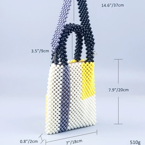 Detail view of handmade beaded tote with geometric color blocks and size measurements