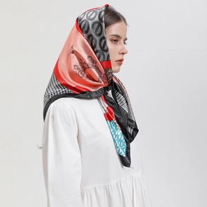 Floral and houndstooth printed satin square scarf styled as an elegant headscarf for women