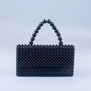 Handmade black acrylic beaded handbag with marble finish and elegant top handle strap