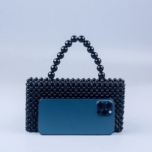 Vintage black marble acrylic beaded handbag with rounded handle and rectangular shape