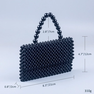 Detailed view of black acrylic beaded handbag with measurements showing 21x12x2cm dimensions
