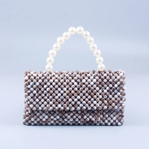 Detail of handmade marbled acrylic beads and white faux pearl handle on the handbag