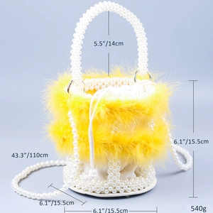 Detail view of yellow feather bucket bag showing exact dimensions and pearl handle