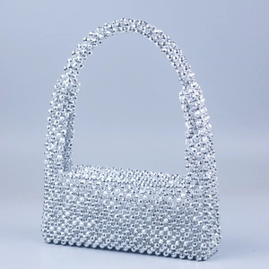 Elegant handmade silver beaded flap handbag with multifaceted beads and shoulder strap