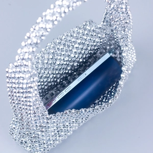 Silver beaded mini handbag with acrylic angular beads showing interior phone storage space