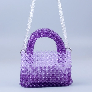 Detail of purple gradient acrylic beaded bag with handmade weave and clear chain