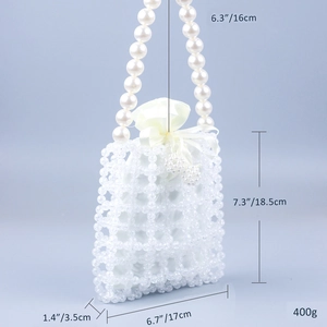 Detail view of beaded handbag with size markings, white acrylic beads and pearl handle