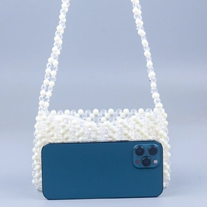 Handmade beaded shoulder bag with white and clear beads, stylish wavy weave and double chain