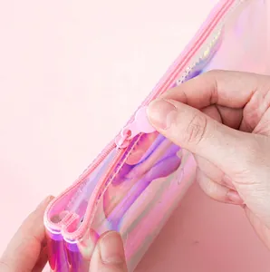 Iridescent laser pencil case with pink zipper showing holographic PVC material