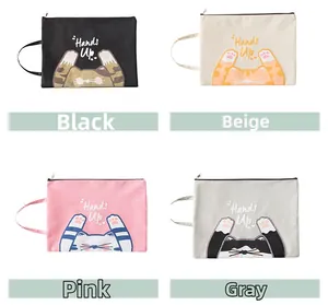 Detail of four colorful oxford fabric file bags featuring cat prints and top zippers