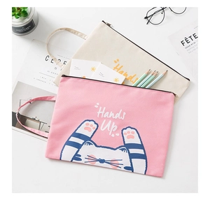Detail of pink and beige Oxford cloth file bags featuring cute cat illustrations with handles