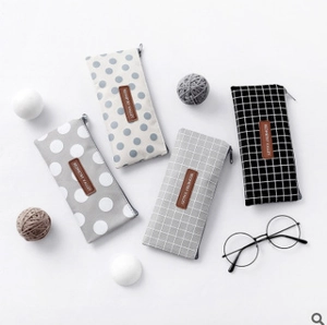Canvas pencil cases with grid and polka dot patterns for stationery organization