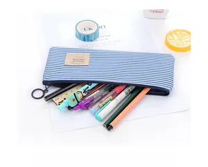 Top-down view of a large-capacity striped Oxford cloth pencil pouch on a white desk