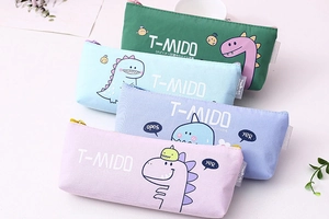 Detailed group view of four canvas pencil cases with cartoon dinosaur prints in pastel colors