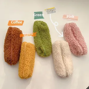 Detailed view of plush pencil cases in coffee, yellow, green, white, and pink fleece