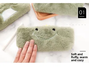 Detailed close-up of soft green plush pencil case with cute monster embroidery