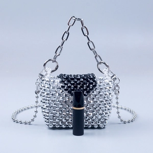Silver and black beaded mini handbag with metal handle and crossbody chain strap
