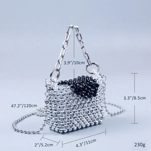 Detail view of silver and black beaded mini bag with chain handle measuring 11x5.2x8.5cm