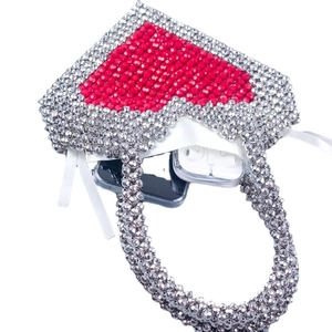 Handmade beaded heart handbag with red and silver faceted beads showing storage capacity