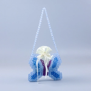 Detailed view of handmade beaded butterfly bag with purple and blue beads and inner pouch