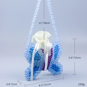 Detail view of handmade blue beaded butterfly bag with dimensions and inner satin pouch
