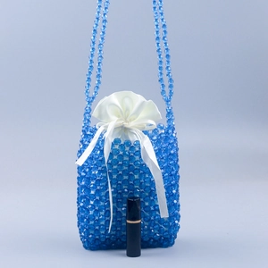 Handmade blue beaded shoulder bag with satin drawstring pouch and elegant ribbon detail