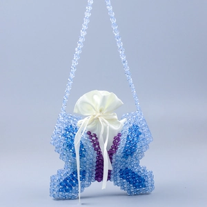 Handmade butterfly shaped beaded shoulder bag with blue and purple beads and satin liner
