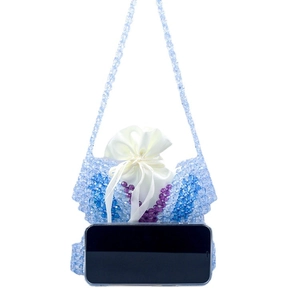 Blue beaded butterfly shoulder bag with satin pouch, shown next to a smartphone for size