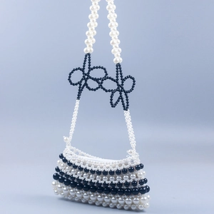 Handmade black and white beaded handbag with cute bows and pearl strap for women