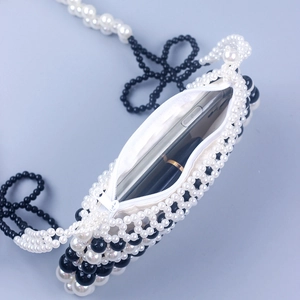 Handmade black and white pearl beaded crossbody bag for phone with zip closure