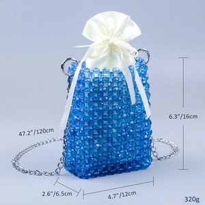 Blue beaded crossbody bag with white satin drawstring pouch and silver chain strap details