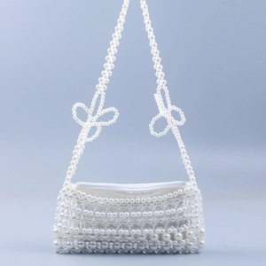 Handmade white pearl and crystal beaded underarm bag with decorative bow handles